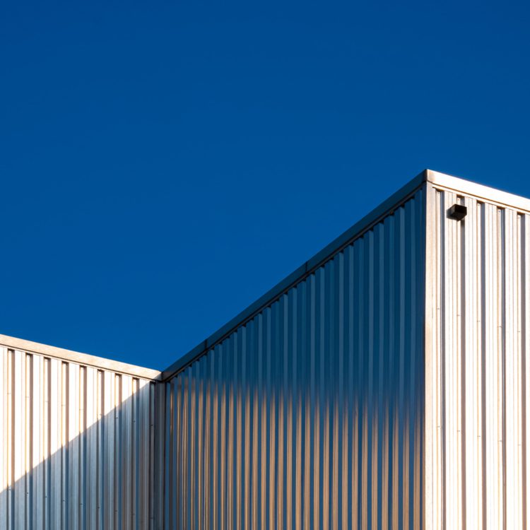 Sunlight reflecting off walls of large building