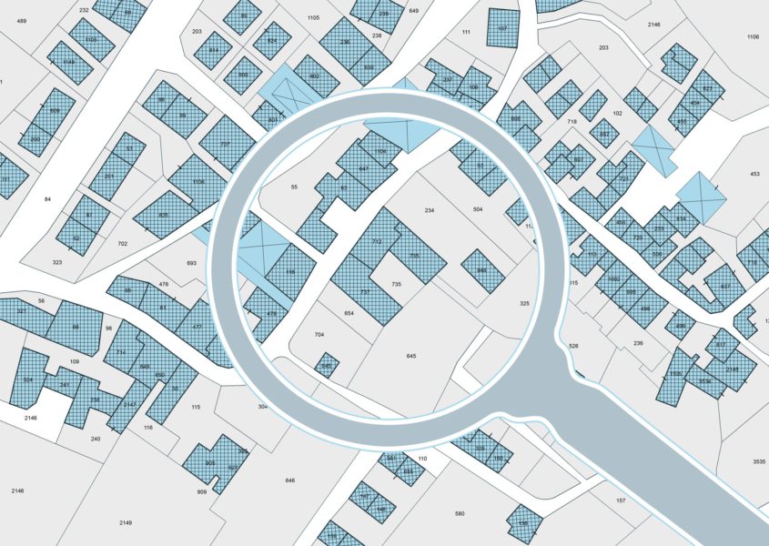 Magnifying glass focused on map of city