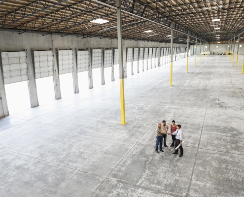 Incentives for Manufacturers being discussed in a large warehouse