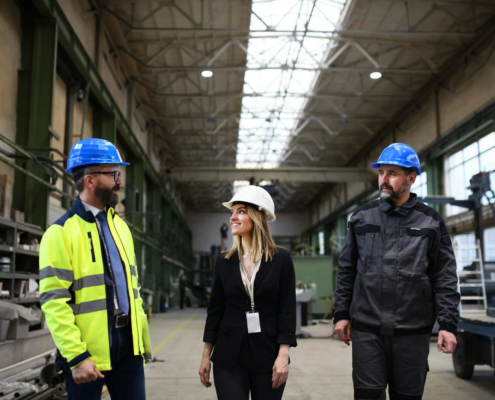 Company leaders planning a manufacturing facility expansion illustrating incentives and sustainable growth