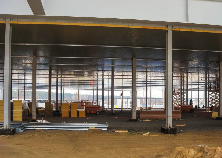 Construction site with idle equipment illustrating relocation delays and rising project costs